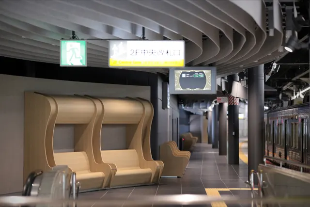 曲線の天井とベンチが並ぶ駅ホームの空間